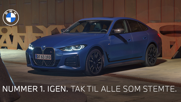 Blå BMW med tekst "nummer 1. igen. tak til alle som stemte" henover 